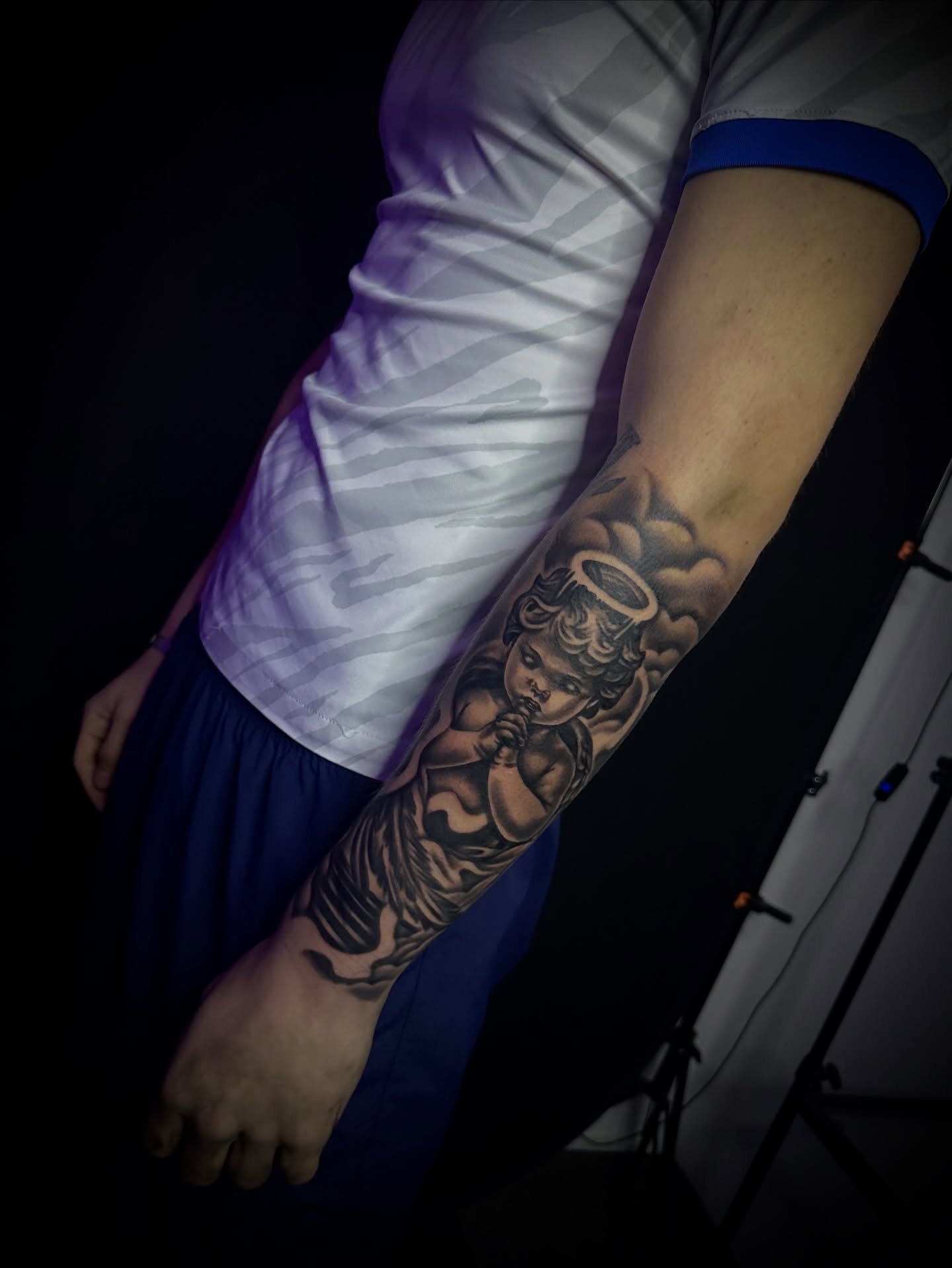 Angel cherub forearm tattoo